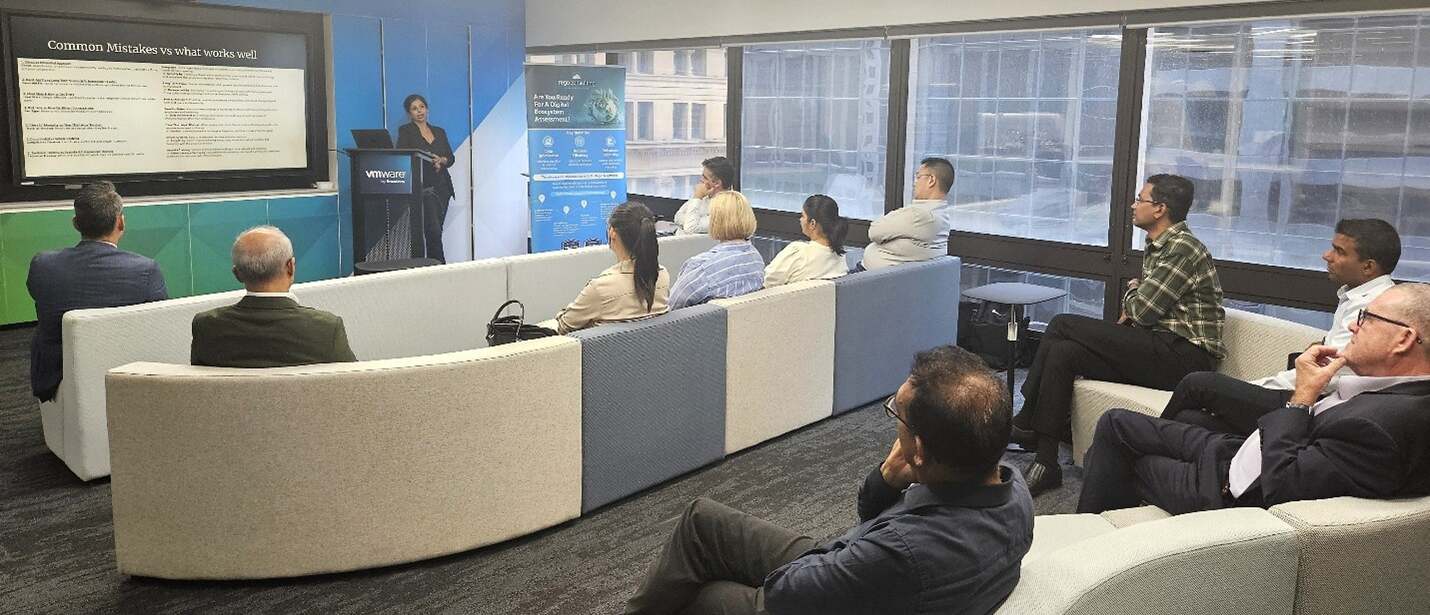Australia Presenter discusses common mistakes and best practices with seated attendees at a Clarity user group session.