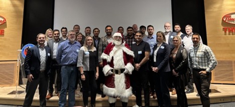 Toronto Santa1 Group photo of Clarity user group attendees with Santa Claus at the center.